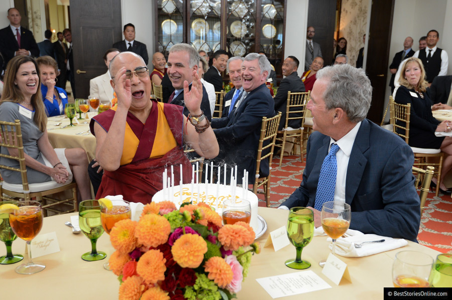 The Dalai Lama attending a charity dinner with former President George W. Bush.